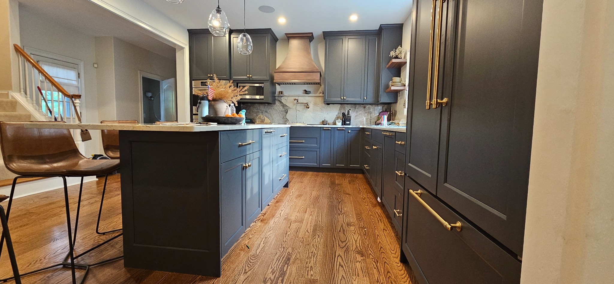 Custom frameless full-overlay kitchen cabinetry with a large island